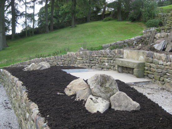 Topsoil into the flower beds 